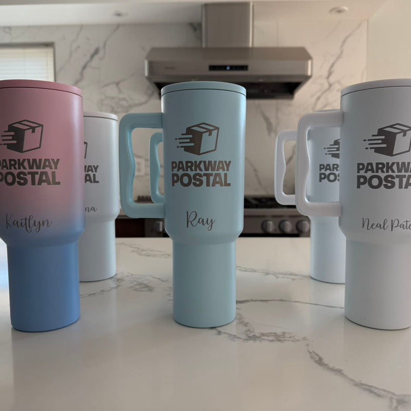 Pastel tumblers personalized with the Parkway Postal logo and individual names.