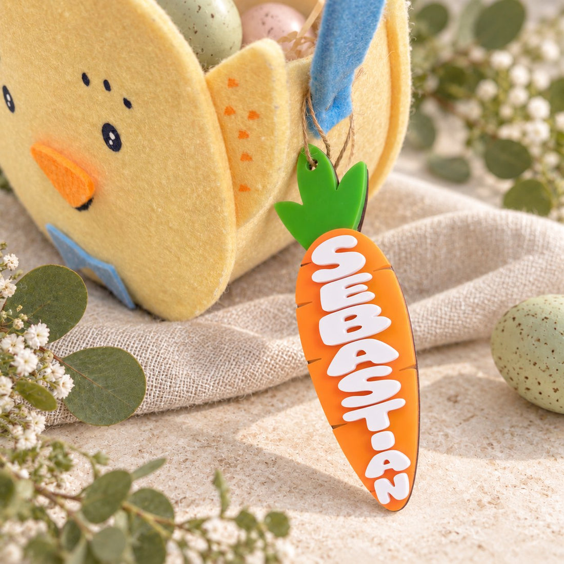 Personalized acrylic carrot basket tag with Evelyn name on warm stone.