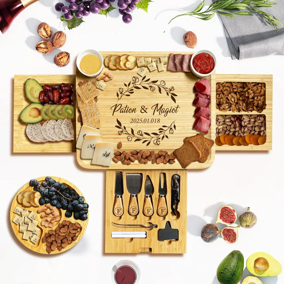 Three-drawer bamboo charcuterie board with four cheese utensils, corkscrew, silver spoon, two white markers and chalk label