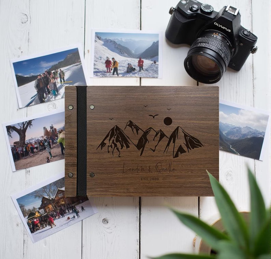 Light wood adventure guest book with mountain engraving on warm stone