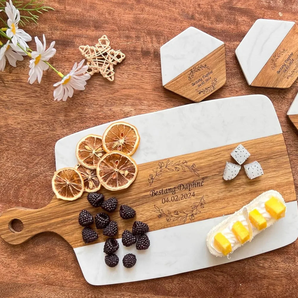 Personalized wooden cutting board with engraved text on a wooden surface with decorative elements.