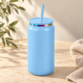 Sky blue 16oz can tumbler with straw on warm cream stone