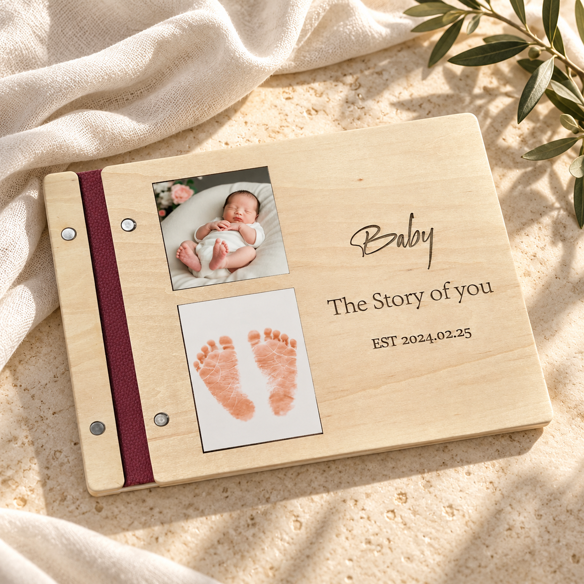 Baby shower guest book with photo and footprint cover on warm stone