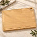 Blank bamboo cutting board with corner hanging hole and juice groove