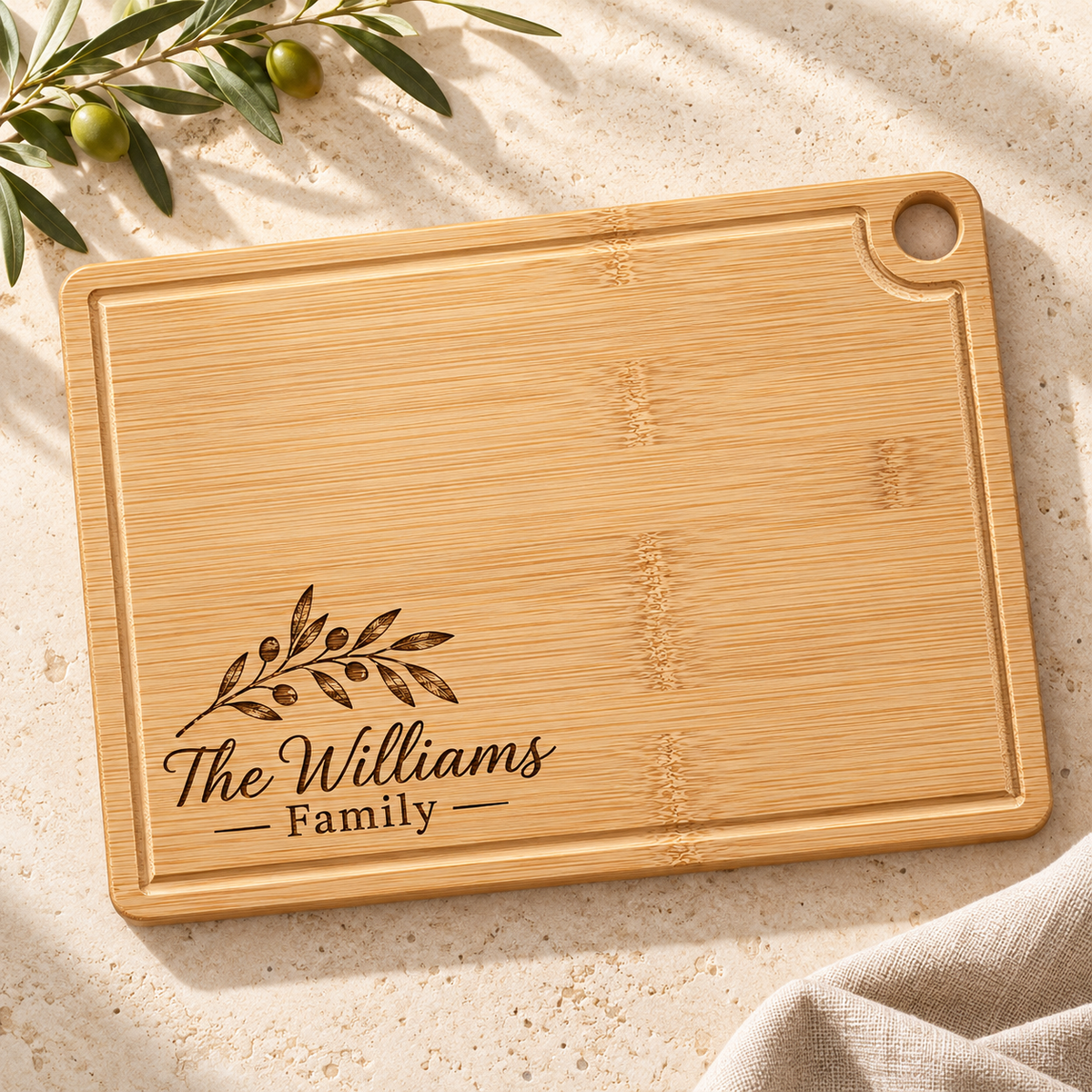Personalized bamboo cutting board with corner hanging hole and engraved family name
