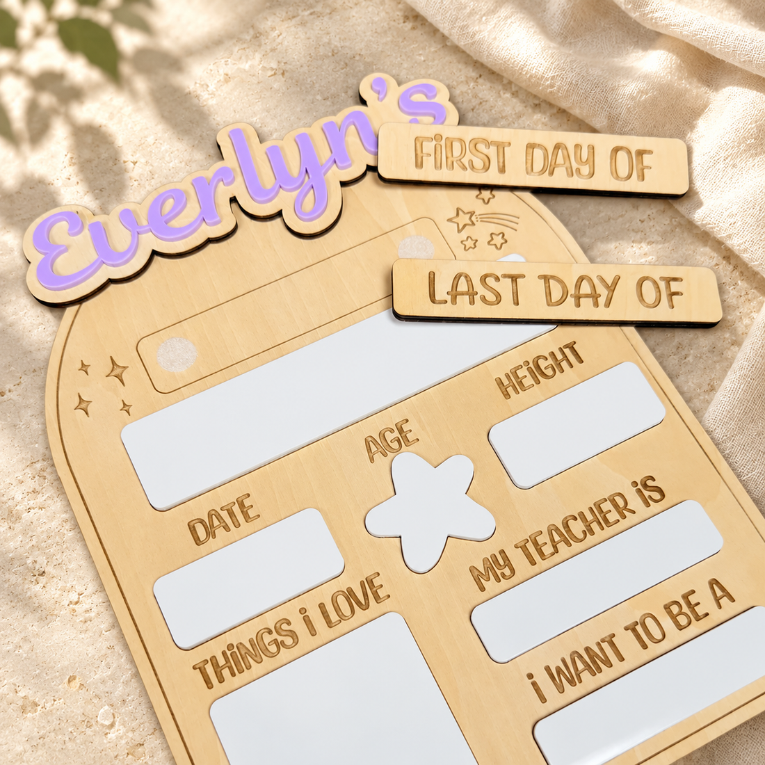 Personalized first and last day school sign on a warm cream tabletop
