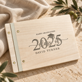 Engraved Class of 2025 graduation guest book on warm stone with natural light