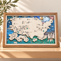 Framed National Parks travel map displayed in a warm cream and oak interior
