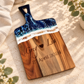 Ocean-resin acacia charcuterie board on warm stone
