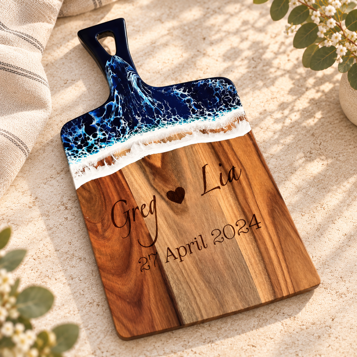 Ocean-resin acacia charcuterie board on warm stone