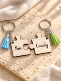 Wooden puzzle keychains engraved Max and Cassidy, separated on warm stone