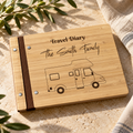 Travel diary scrapbook with engraved Smith family camper cover on a warm stone surface