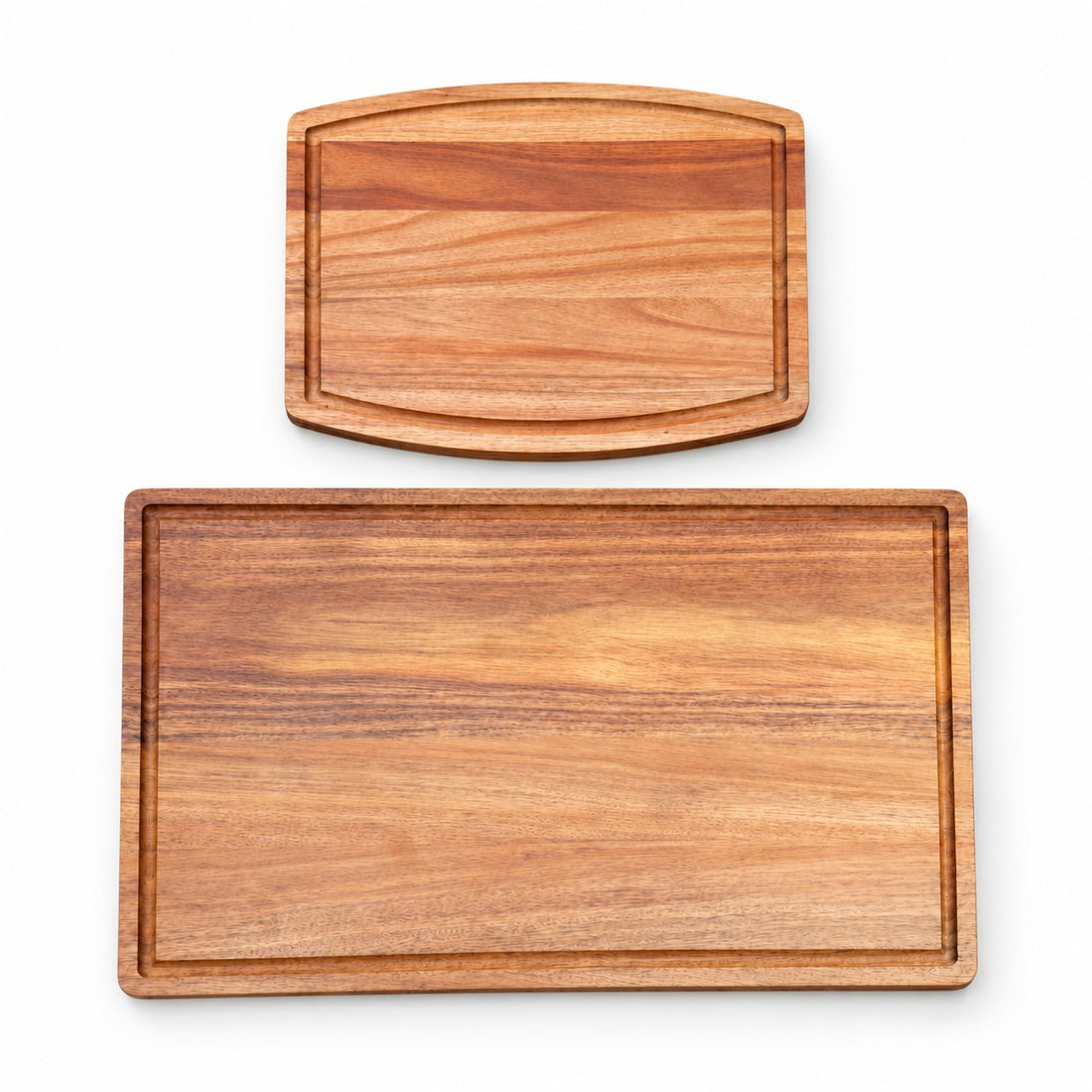 Two blank bamboo cutting boards on a white background, showing the medium and large sizes