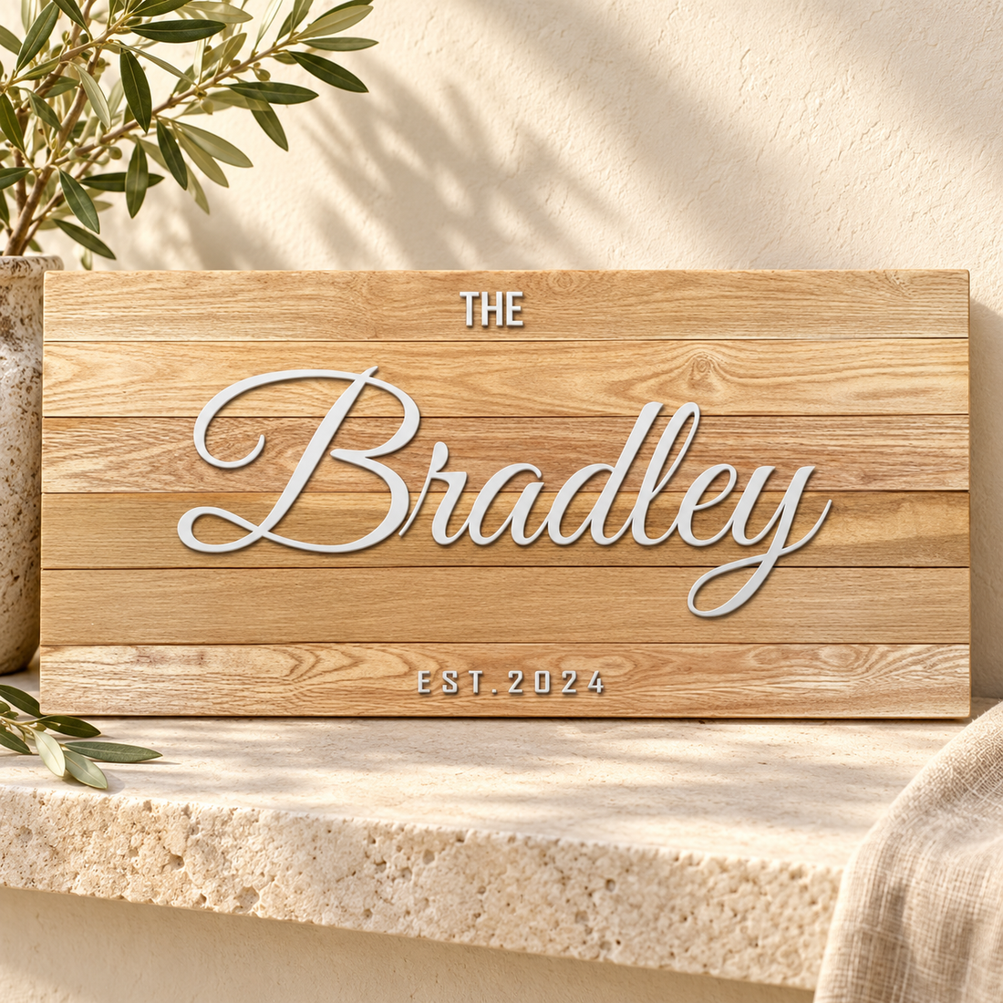 Family name wooden sign on warm stone