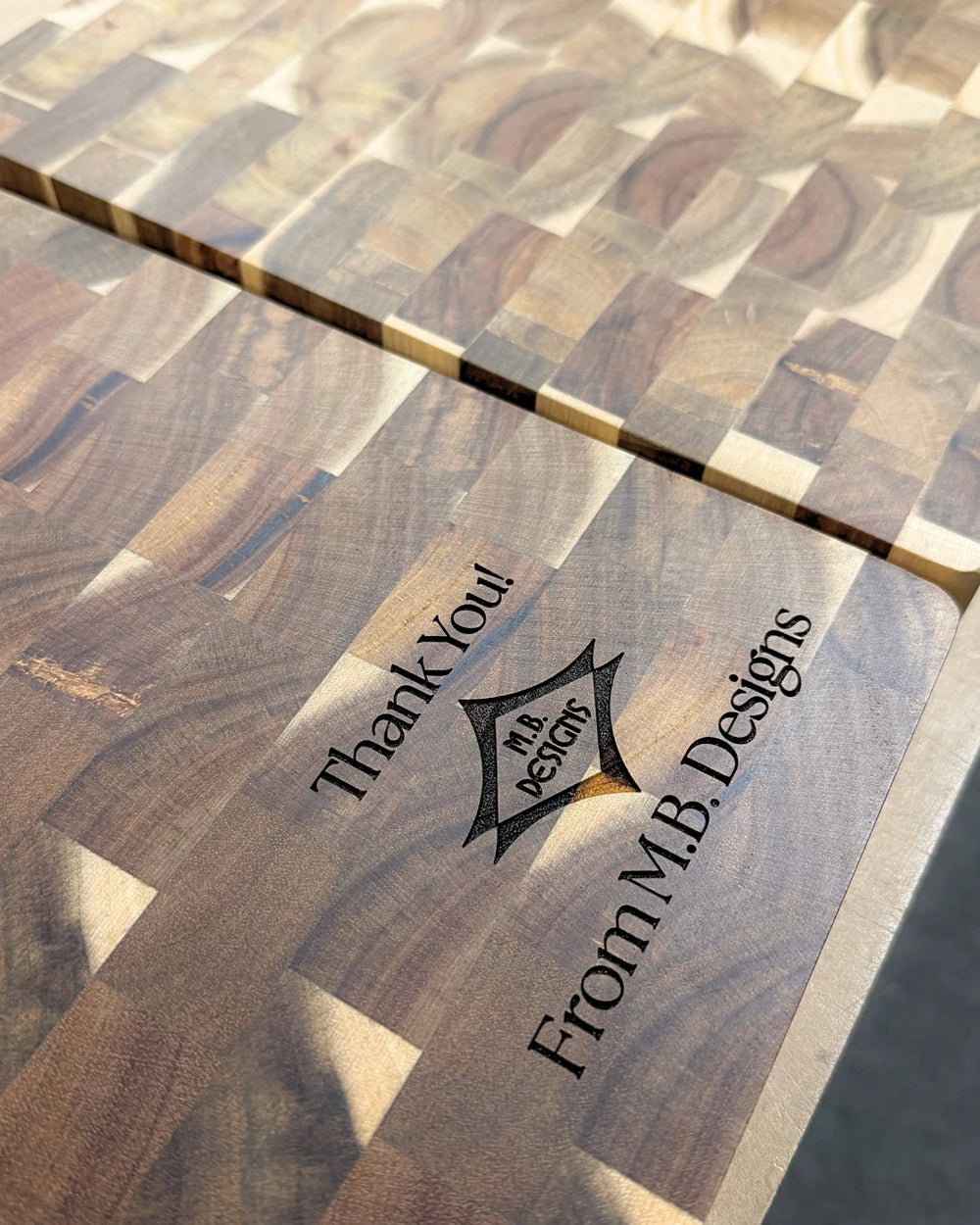 Thank-you message and business logo engraved on a wooden board