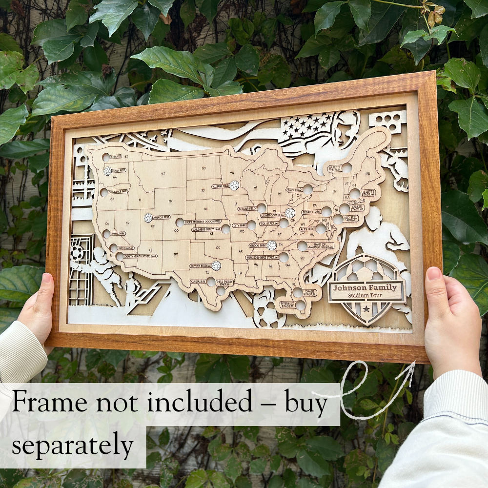 Wooden map of the United States with soccer stadiums on a stand